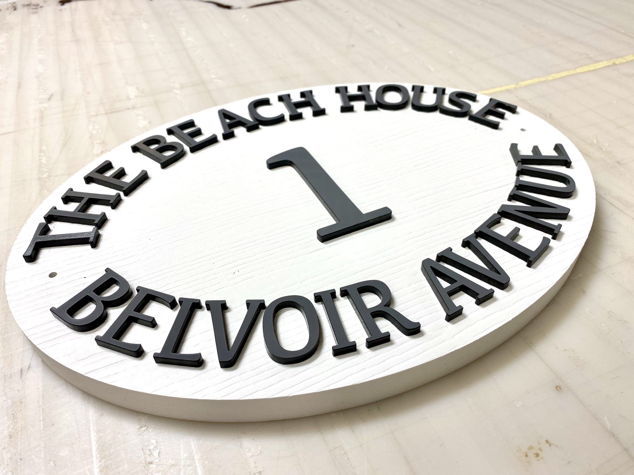 air bnb house sign carved