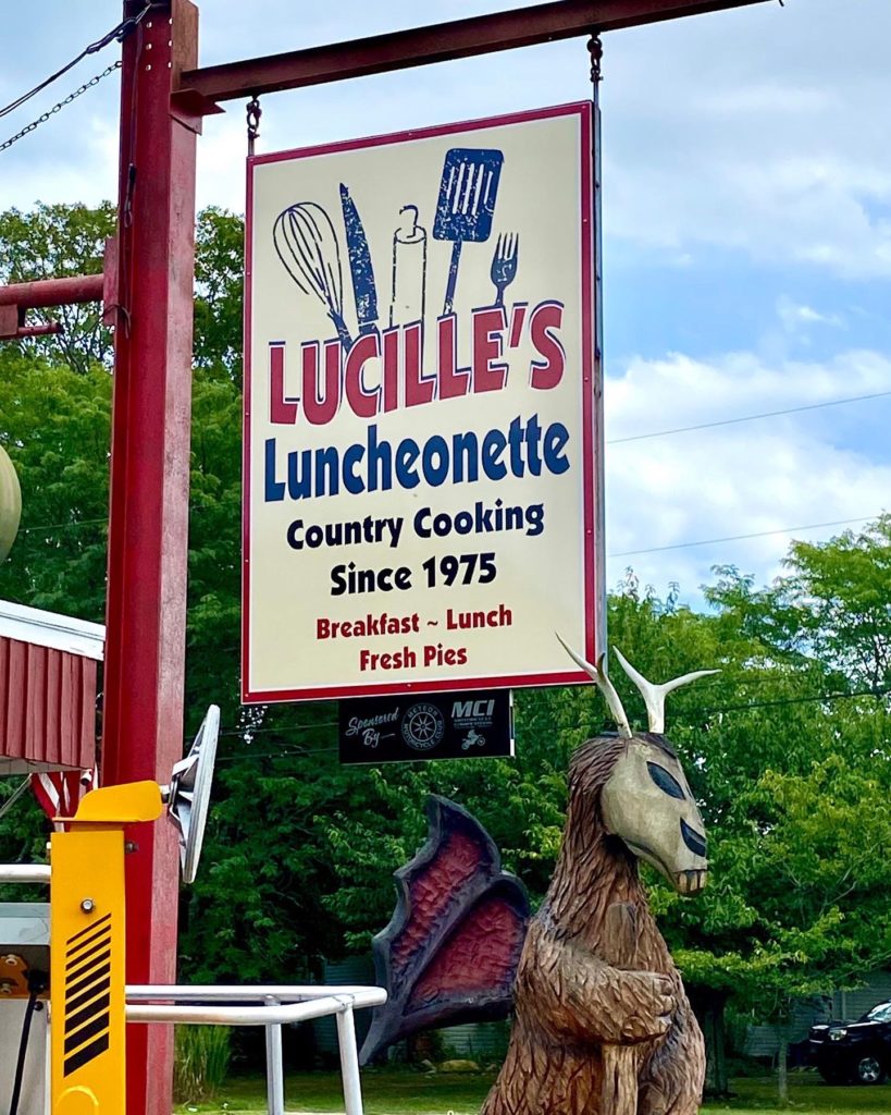 Lucille's luncheonette hanging restaurant sign
