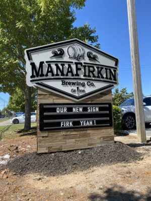 Monument style brewery sign for manafirkin brewing with changeable letter marquee