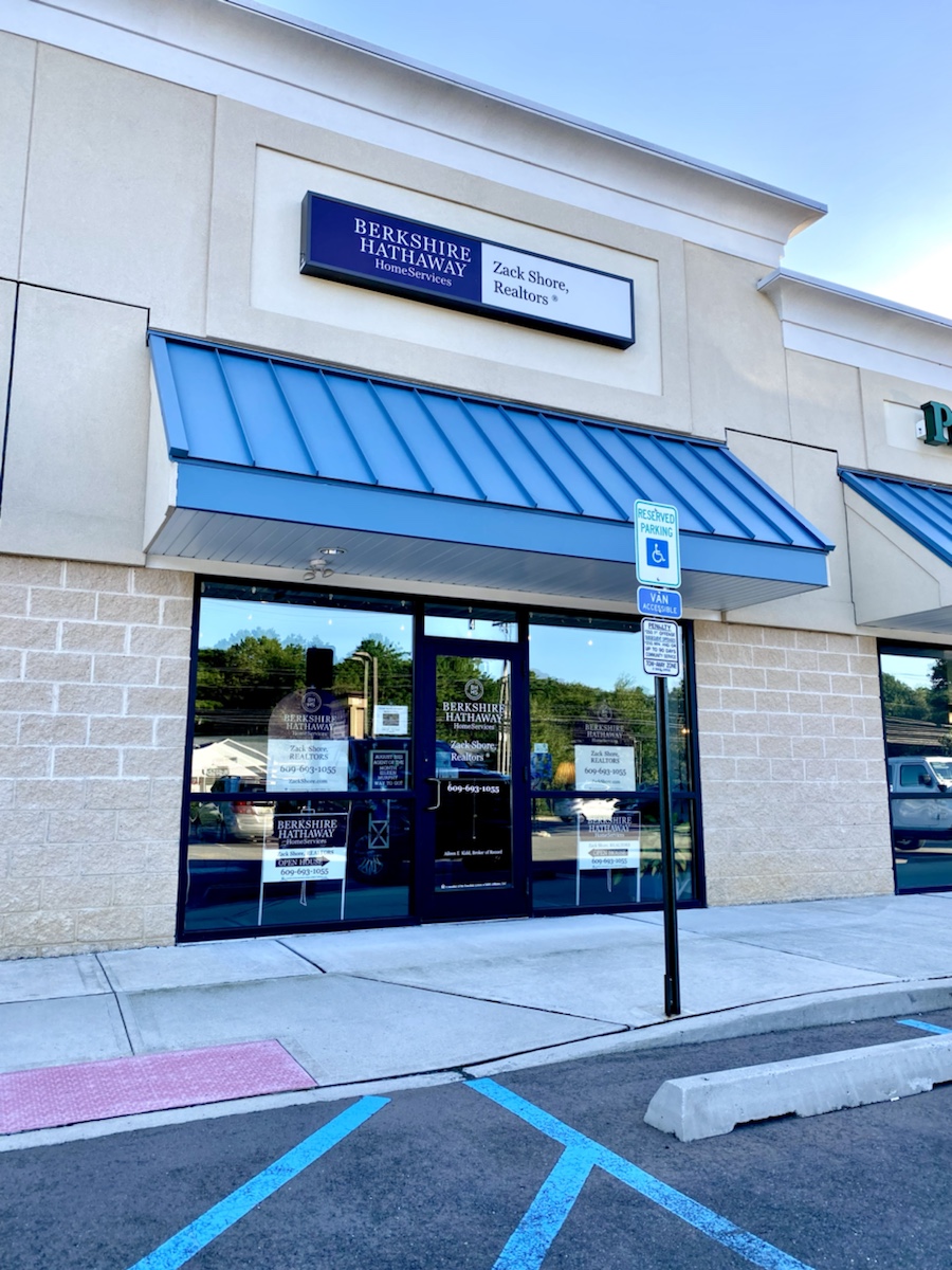 Commercial storefront backlit sign and window lettering graphics￼