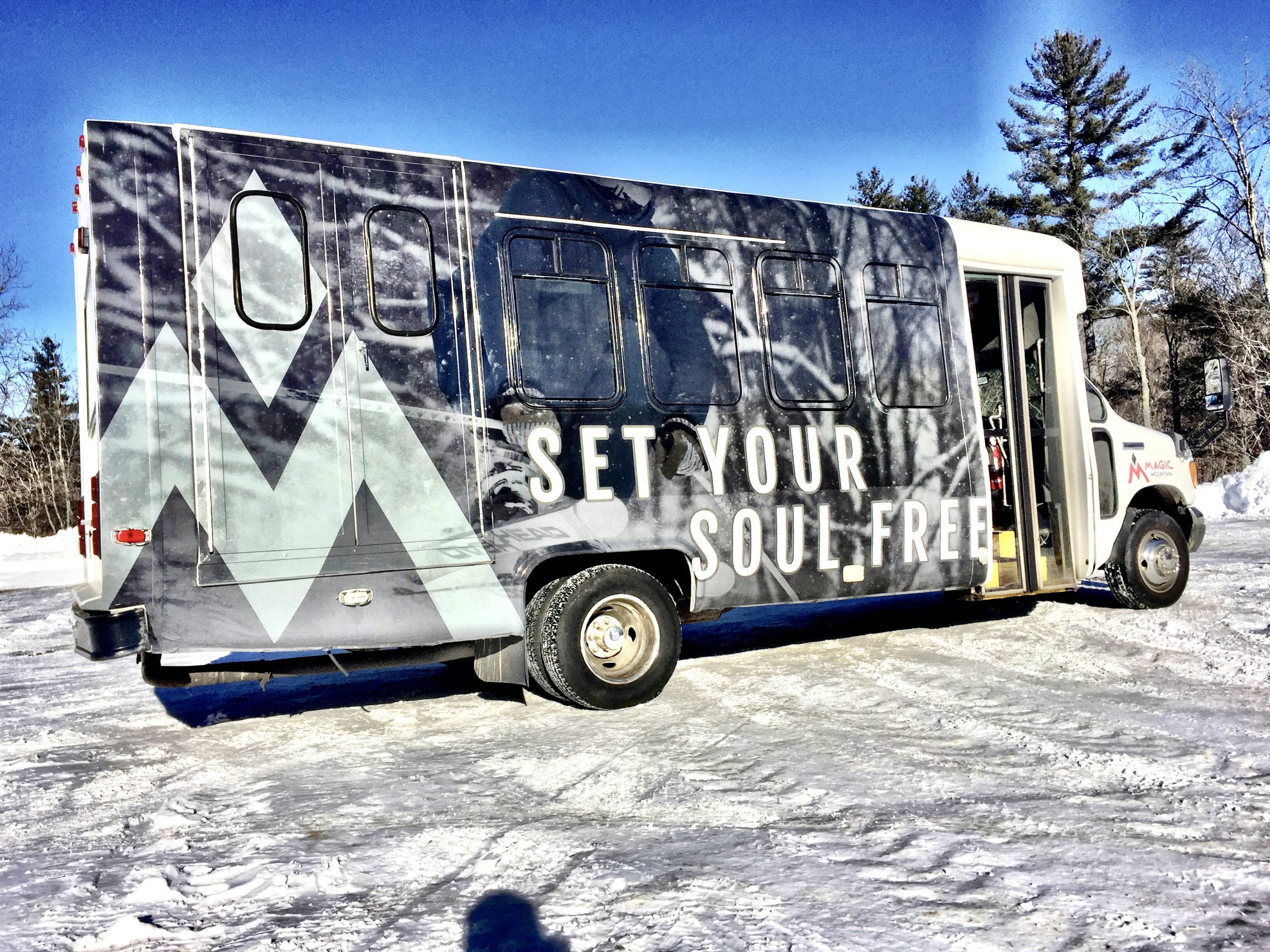 A shuttle bus for Magic Mountain Vermont with a custom vinyl wrap