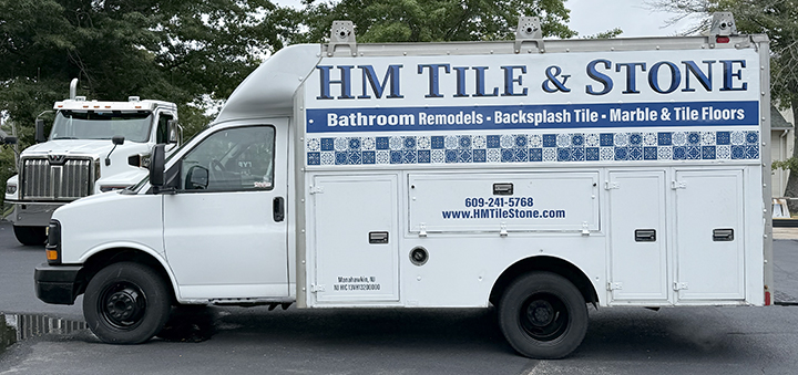 Older HM Tile & Stone work truck refreshed with new wrap graphics after removal of the previous vehicle wrap