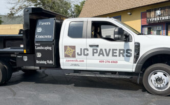 JC Pavers contractor dump truck with custom vehicle graphics, company branding, services, website and phone number in Manahawkin, New Jersey