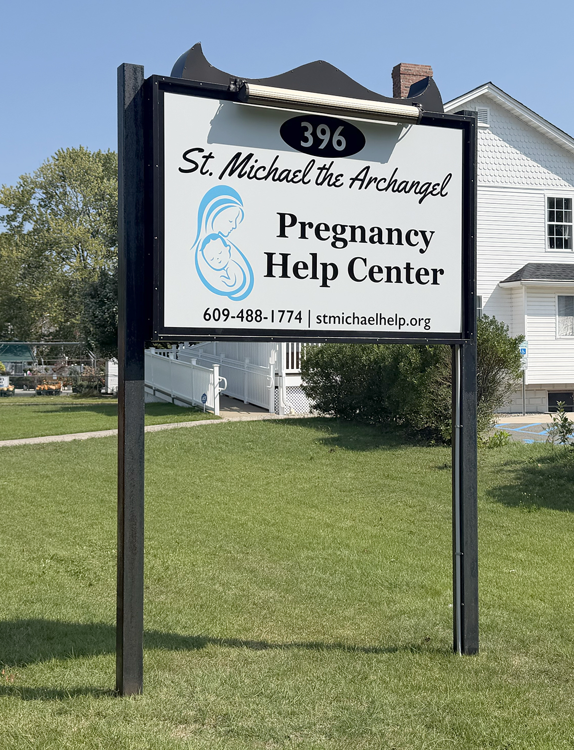 Post and panel roadside identification sign for St. Michael the Archangel Pregnancy Help Center in Barnegat, New Jersey