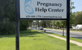 New roadside sign for St. Michael the Archangel Pregnancy Help Center in Barnegat, New Jersey, installed in an existing post and panel sign structure