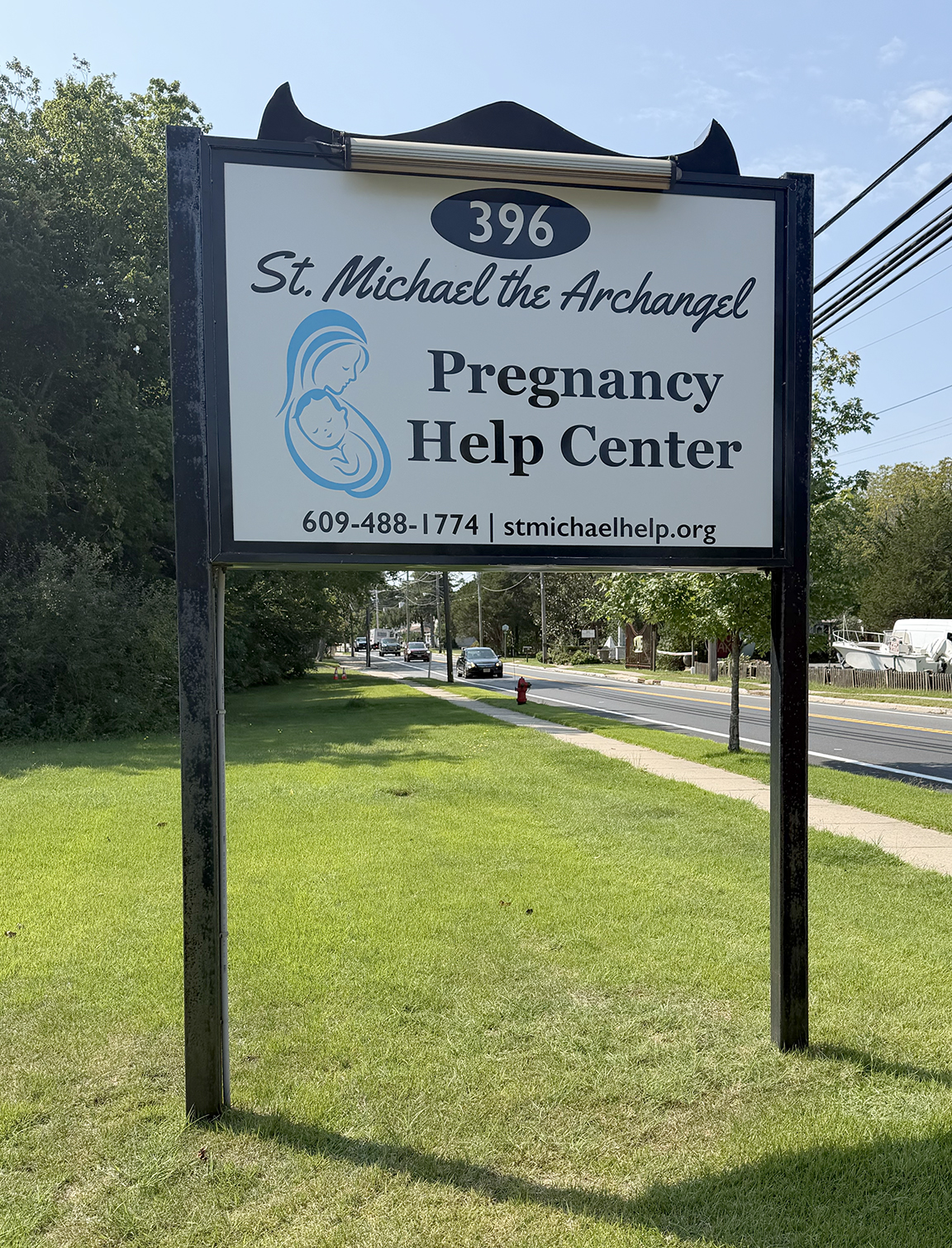 New roadside sign for St. Michael the Archangel Pregnancy Help Center in Barnegat, New Jersey, installed in an existing post and panel sign structure