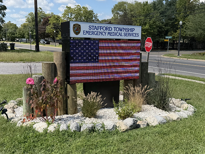Stafford Township Emergency Medical Services LED message center sign with custom backlit header and American flag display