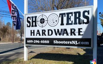 New backlit roadside sign for Shooters Hardware in West Creek NJ with custom branding, LED illuminated sign cabinet and coastal-durable materials