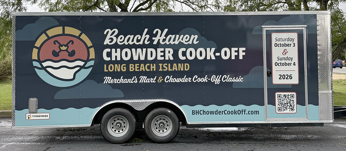 Angled view of the Beach Haven Chowder Cook-Off enclosed trailer wrap with custom event branding on the side and front panels