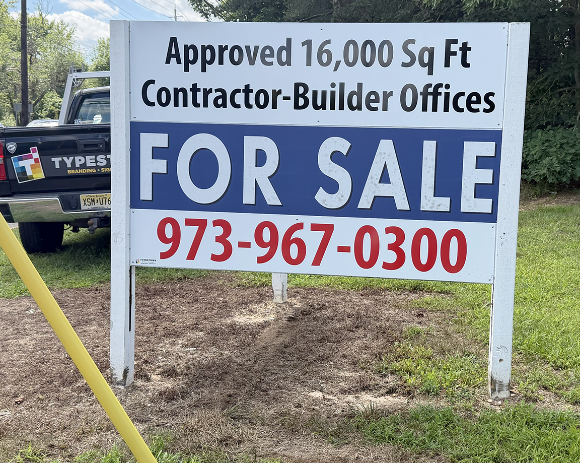 Large commercial real estate For Sale roadside sign on Route 9 in West Creek NJ advertising approved contractor-builder office space