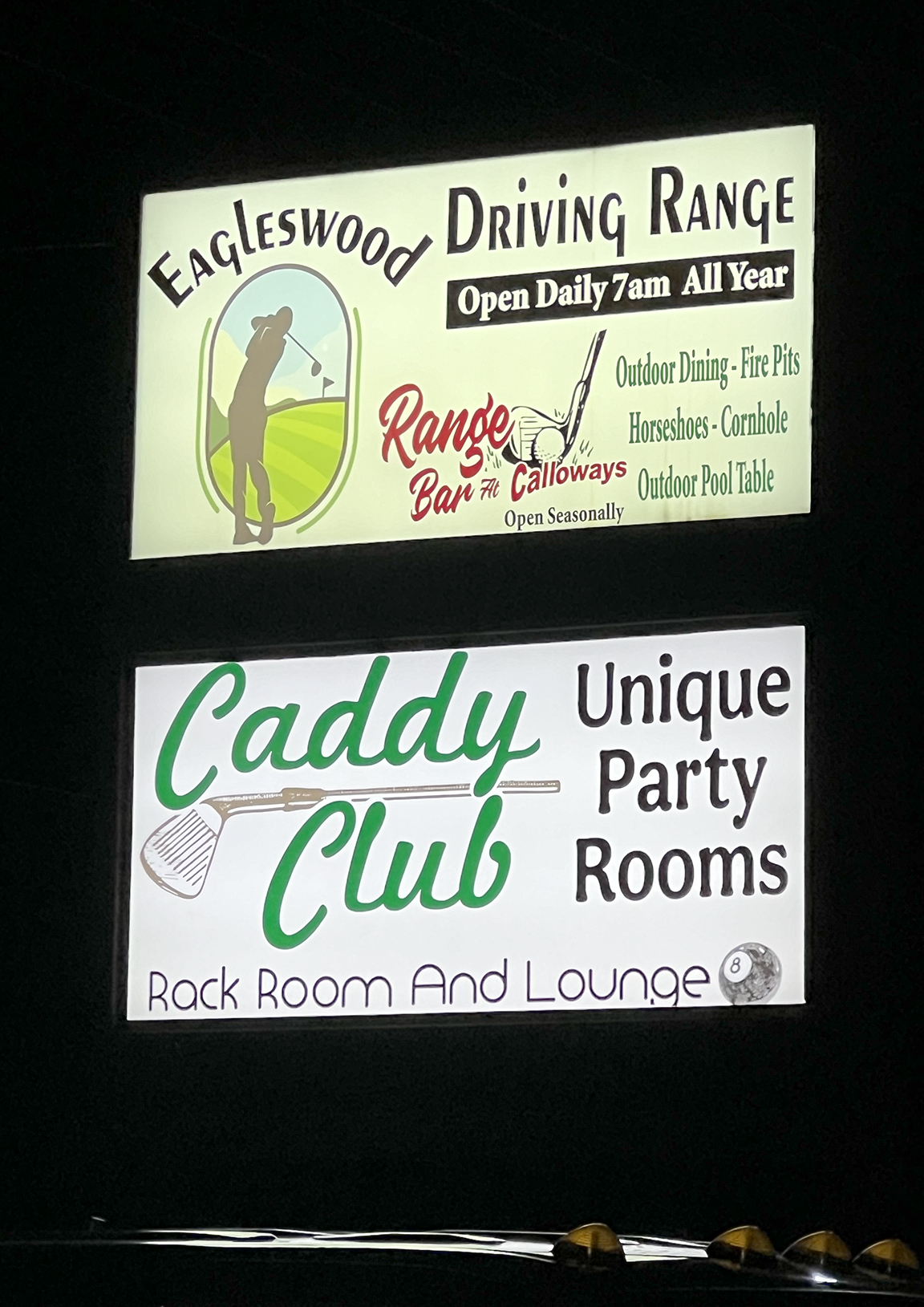 New LED illuminated sign faces for Eagleswood Driving Range and Caddy Club photographed at night in West Creek NJ