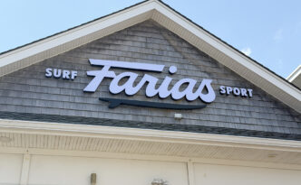 Full storefront gable at Farias Surf & Sport in Ship Bottom, NJ, with dimensional trimless channel letters on weathered cedar shingles