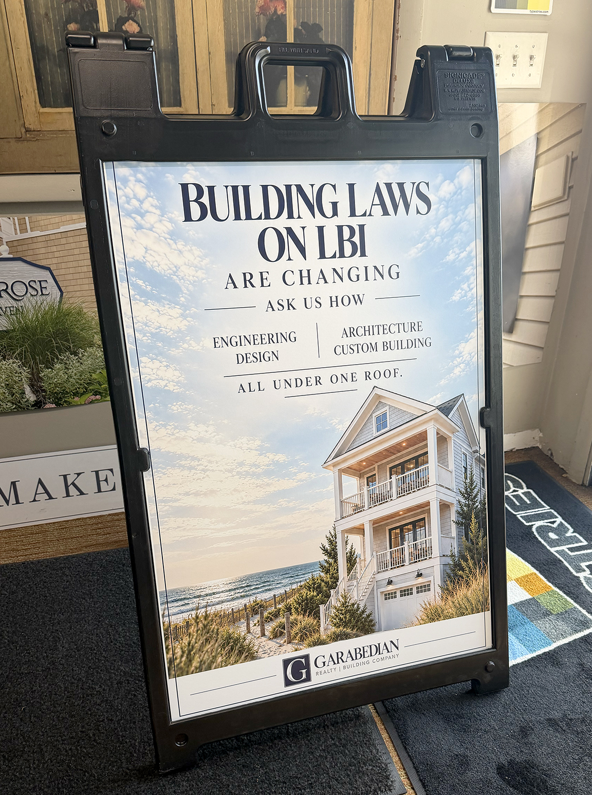 Custom Garabedian Group A-frame event sign promoting changing building laws on Long Beach Island at the Chowderfest Merchants Mart