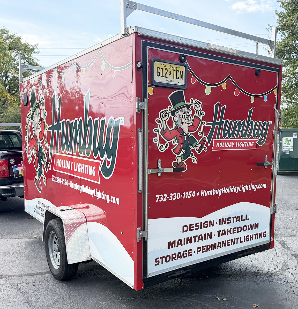 Humbug Holiday Lighting enclosed trailer wrap showing the rear and side holiday lighting branding in Ocean County, New Jersey