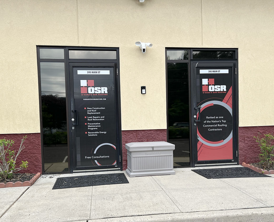 Custom black red and gray glass entry door branding graphics for O'Hara's Son Roofing office in West Creek NJ, featuring logo and service information