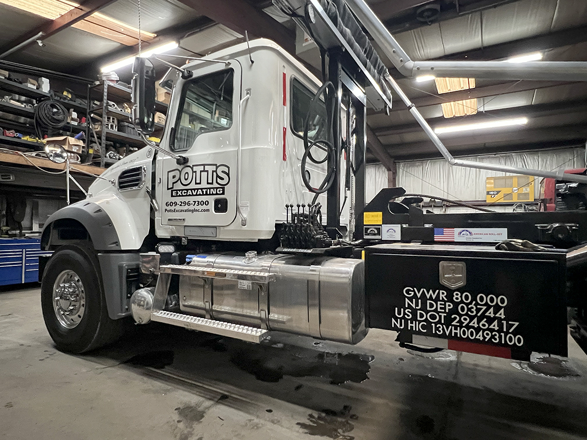 Potts Excavating Mack roll-off truck lettering West Creek NJ