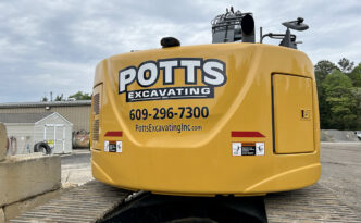 Potts Excavating excavator branded with custom printed equipment graphics for jobsite visibility in West Creek and Southern Ocean County NJ
