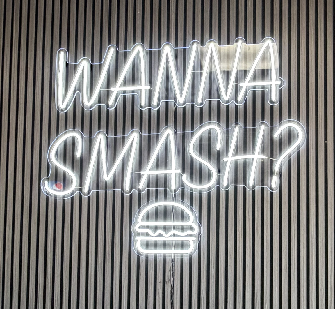 Custom white LED neon sign reading Wanna Smash with burger icon for Smash N Grab Burgers on Mill Creek Road in Manahawkin, New Jersey
