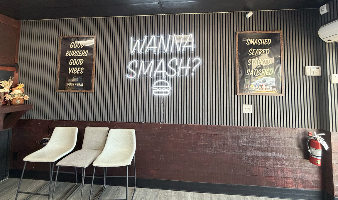 Complete Smash N Grab interior branding wall featuring custom LED neon, changeable poster displays and restaurant decor in Manahawkin NJ